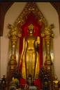 The main Buddha (Goddess of Mercy) image at Nakhon Pathoms giant stupa.  Here, its lit up in neon and gold at night.